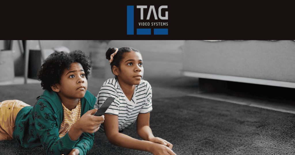 Two kids watching TV