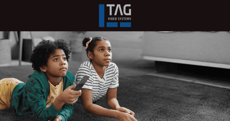 Two kids watching TV