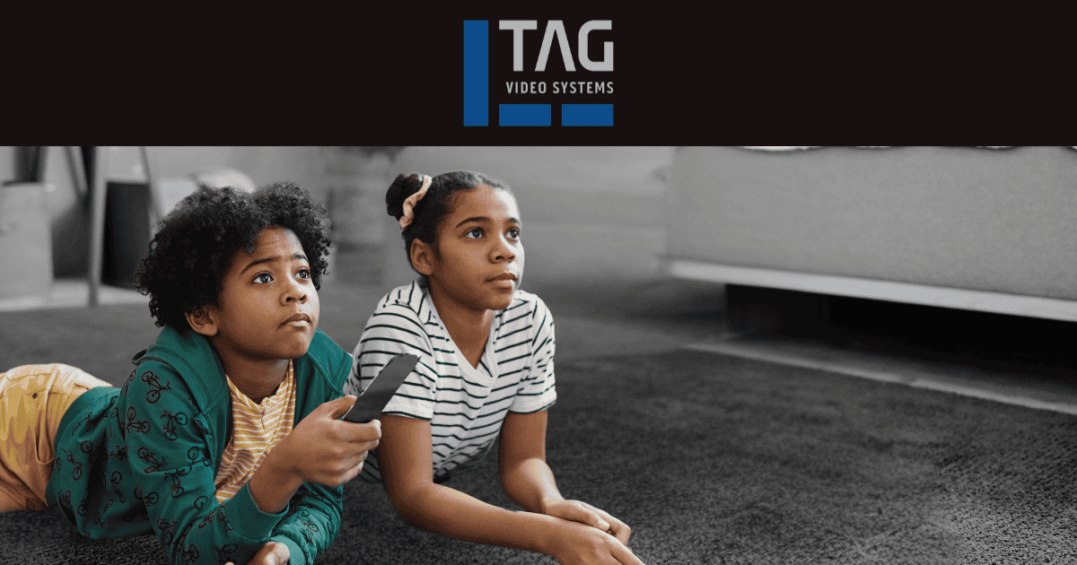 Two kids watching TV